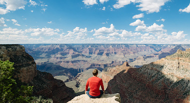 Man overlooking epic view of the Grand Canyon National Park