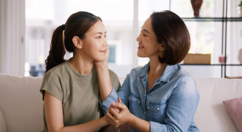 Asian mother and child talking about respectful communication norms