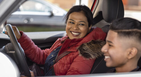 Mother and son driving and talking in the car