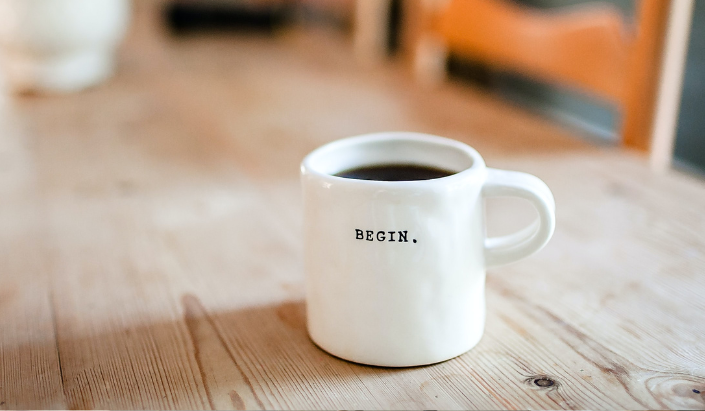Mug with the word begin printed on it
