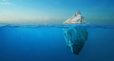 Iceberg With Above And Underwater View Taken In Greenland.