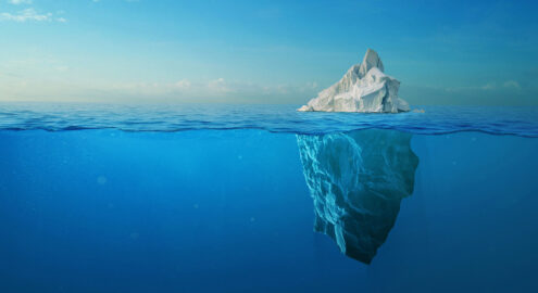 Iceberg With Above And Underwater View Taken In Greenland.