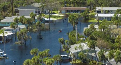 Neighborhood homes surrounded by flood water