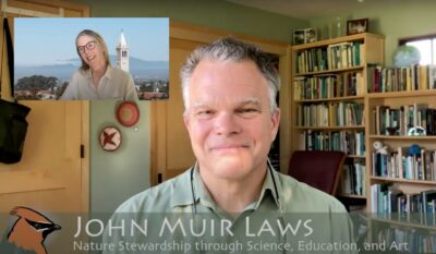 Image of man smiling and looking at camera on Zoom with woman in smaller screen smiling